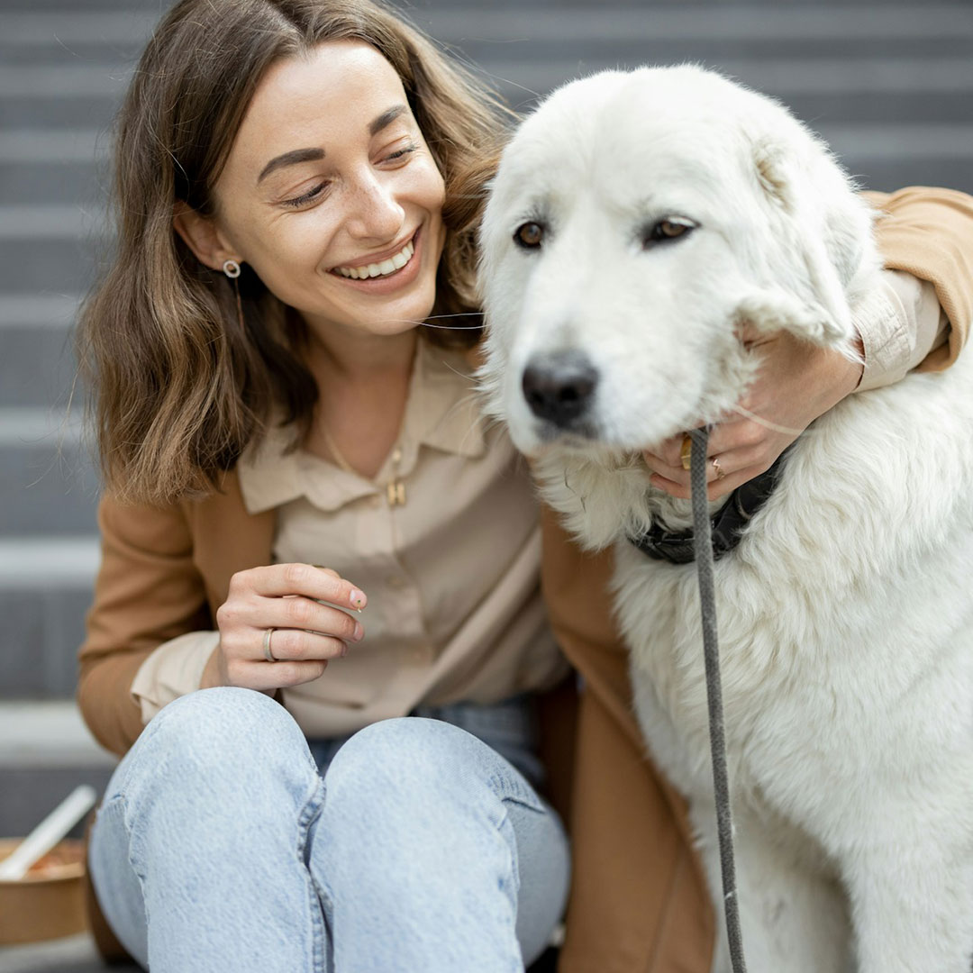 girl holding the dog